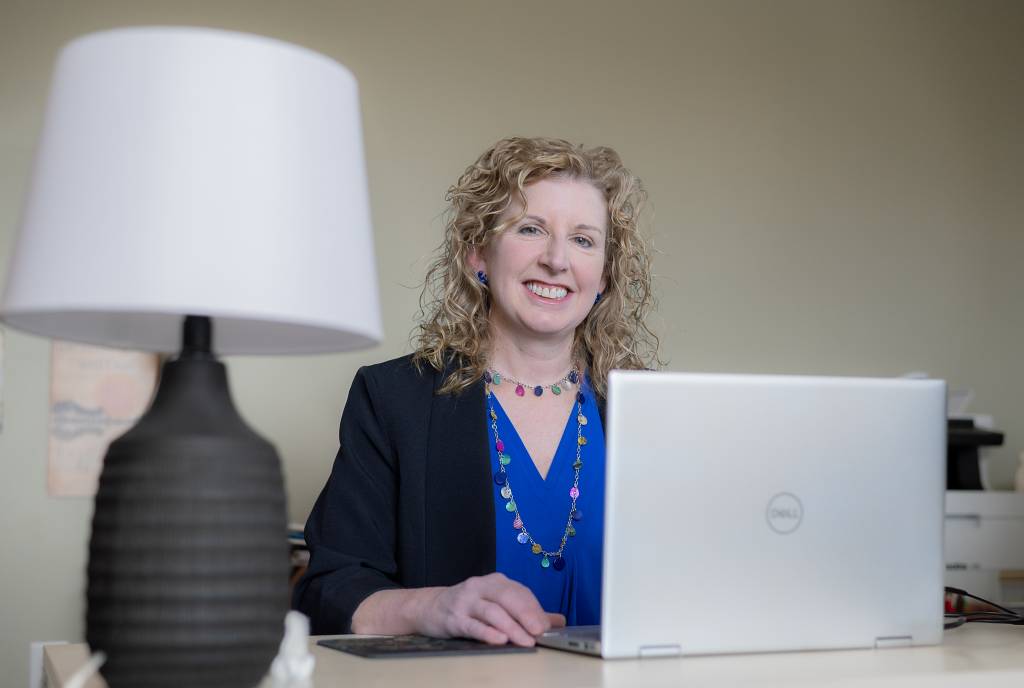 Photo of founder Karen O'Donnell at her desk